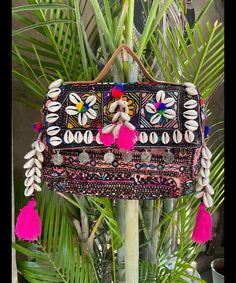 About bag  Indo-gypsy fusion, everyday use hand bag made from Banjara fabrics sourced from Vintage tribal costumes of regions of Rajastan and Gujarat. These are embellished with light catching coins, and intricate bead work tassels. Size - length 15 inches/ width 21 inches Company details:  Company name: Houseoftextile  Contact number: +919784447473  Email id: houseoftextile77@gmail.com  Shipping & custom : Delivery through one of the finest service providers : Skyway, Fedex, UPS  And DHL. Any l Handmade Pouch Bag For Navratri, Rectangular Handwork Festival Bag, Bohemian Rectangular Bag For Festivals, Bohemian Pouch Bag For Festival, Bohemian Festival Pouch Bag, Bohemian Rectangular Bags For Festivals, Bohemian Beach Bag For Festivals, Bohemian Rectangular Shoulder Bag For Festivals, Bohemian Potli Bag With Multicolor Embroidery And Handwork