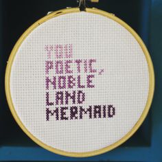 a cross - stitch pattern with the words you're here now and mermaid on it