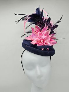 "Elegant large 18\" Navy blue and pink hat accented with different shades of pink feathers. Mounted on a 2\" headband for a secured look. Style to go with a variety of outfits: bridesmaids,  cocktail party,  Kentucky Derby, Rehearsal dinner, Easter and church outfits.  Ones with hair clip and headband. Are you trying to match an outfit? Send a picture and I will help you find a best hat to match your outfit.  - Rare find - Ready to ship  - Lightweight - Free Shipping - Fast shipping - Customize by adding different color flowers and or feathers Check my store for for styles and colors.  Hatsandpearls.etsy.com Find more at my website: www.hatsandpearls.com Reach out to me if you can't find what you are looking for.  I can make cake custom orders and help you style and match your outfit  Than Pink Feather Trim Mini Hat For Evening, Pink Mini Hat With Feather Trim For Evening, Fitted Pink Mini Hat With Feather Trim, Fitted Pink Fascinator With Feather Trim, Adjustable Pink Mini Hat With Feathers, Pink Feather Trim Costume Hats For Royal Ascot, Pink Feather Trim Fascinator For Royal Ascot, Pink Feather Trim Hat For Evening, Pink Feather-trimmed Costume Hats For Royal Ascot