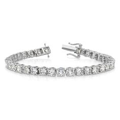 Rhodium over 14K white gold tennis bracelet with prong set 11.01 cttw lab grown diamonds and polished finish. Measures approximately 7"L x 3/16"W and has a box catch clasp. Lab grown diamonds are of VS/SI clarity and G-H color grade. White Gold Tennis Bracelet With Lab Grown Diamonds, White Gold Lab-grown Diamond Tennis Bracelet With Prong Setting, White Gold Lab Grown Diamond Tennis Bracelet, White Gold Tennis Bracelet With Lab-grown Diamonds, Formal White Gold Tennis Bracelet With Lab-grown Diamonds, Modern White Tennis Bracelet With Prong Setting, Modern Diamond White Platinum Tennis Bracelet, Gold Tennis Bracelet, Diamond Tennis Bracelet