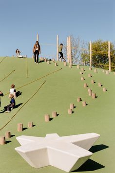 children playing on the top of a play structure