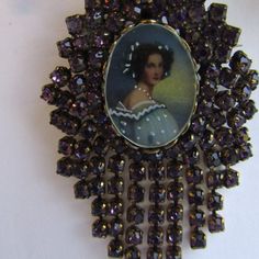 Rare Signed Three Piece Hobe Pin/Pendant And Earrings Set Featuring Portraits Under Glass And Beautiful Purple Rhinestones. The Pin Can Also Be Worn As A Pendant. Signed. Measures 2.5" Long. In Excellent Condition With No Missing Rhinestones. Earrings Are Clip On, Also Signed. Measure 1.5" Long. In Excellent Condition With No Missing Rhinestones Purple Brooch Jewelry For Evening, Victorian Rhinestone Jewelry Gift, Victorian Rhinestone Jewelry For Gifts, Victorian Jewelry With Rhinestones For Anniversary, Victorian Rhinestone Jewelry For Anniversary, Victorian Wedding Jewelry With Rhinestones, Pin Earrings, Purple Rhinestone, Pin Pendant