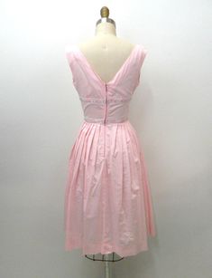 ~vintage 1950s dress featuring... pale pink in color high neckline that gathers at shoulders low cut v in back zips in back with metal zipper pink, silver, and white embroidered ribbon around waist pleated at bust pleated full skirt ~of a lightweight cotton blend material ~no makers tag ~tagged vintage size 9 ~would best fit a size extra small ~in great, vintage condition...there is a small rust spot in the front...very minor ~measurements when laid flat; 15 1/2 inches pit to pit 15 inches shoul Low Cut Back Dress, Bottle Blonde, Embroidered Ribbon, Vintage 1950s Dresses, 1980s Dresses, Pinterest Closet, 1950s Dress, High Waisted Shorts Denim, 50s Fashion