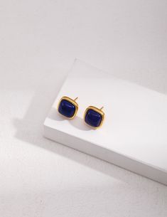 Introducing our Sterling Silver Square Natural Lapis Lazuli Earrings, where the allure of lapis lazuli meets the elegance of sterling silver in a timeless design. Natural Lapis Lazuli Gemstones: These earrings feature square-shaped lapis lazuli gemstones, prized for their deep blue color and captivating natural patterns. Each stone is carefully selected for its unique beauty, making every pair of earrings one-of-a-kind.Sterling Silver Setting: Crafted from high-quality sterling silver, the settings of these earrings provide a beautiful contrast to the rich blue hues of the lapis lazuli gemstones. The sterling silver adds a touch of sophistication and ensures durability for long-lasting wear.Classic Square Design: The square shape of the lapis lazuli gemstones adds a modern twist to these e Elegant Gold Lapis Lazuli Earrings, Blue Lapis Lazuli Earrings For Formal Occasions, Elegant Lapis Lazuli Earrings As A Gift, Blue Polished Finish Earrings For Gift, Elegant Lapis Lazuli Earrings For Gift, Formal Blue Lapis Lazuli Earrings, Natural Patterns, Lapis Lazuli Earrings, Gemstone Stud Earrings