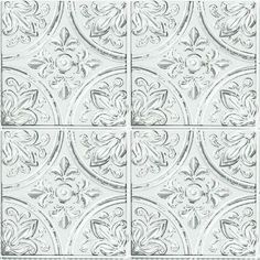 four white tile tiles with floral designs on the sides and one in the middle,