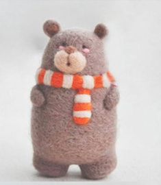 a stuffed animal with a scarf around its neck