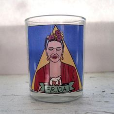 a shot glass with an image of frida on it