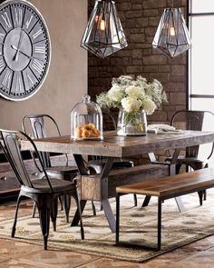 a dining room table with chairs and a clock on the wall