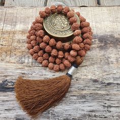 📿Lord Ganesh Blessing Mala is handcrafted with Ganesh Rudraksha Beads. The bead bears a Trunk like elevation as is seen on the face of Lord Ganesha, the son of Lord Shiva. Ganesha, the elephant-headed God of success and overcoming obstacles, is also associated with wisdom, learning, prudence, and power. He gives 'Riddhi-Siddhi'. He is the first to be worshipped at the beginning of any auspicious occasion. Ganesh Rudraksha provides the wearer perfection in every sphere in life and the grace of L Spiritual Mala With 108 Beads For Festival, Traditional Festival Mala With Gemstone Beads, Traditional Gemstone Beads Mala For Festival, Traditional Mala With 108 Beads For Festival, 108 Beads For Festivals, Bohemian Mala With Round Beads For Festivals, Bohemian Beaded Necklace With 108 Beads For Puja, Handmade Mala For Meditation And Diwali, Handmade Spiritual Mala For Diwali