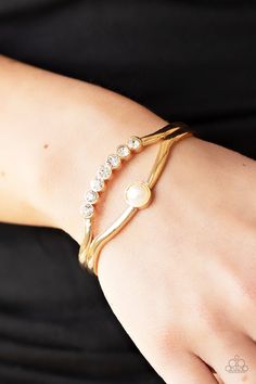 A row of glassy white rhinestones and a solitaire white pearl adorn the layered center of a classic gold cuff, creating a timeless piece around the wrist. Sold as one individual bracelet. Gold Pearl Bracelet, Gold Bracelet Cuff, Gold Cuffs, Paparazzi Accessories, White Rhinestone, Gold Rhinestone, Classic Gold, Rhinestone Bracelet, Paparazzi Jewelry