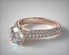 a close up view of a diamond ring with diamonds on it's sidestone