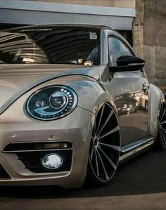 a silver car parked in front of a building