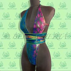 Thanks to a clever Bellacherta design, this reversible one-piece plunging neck backless halter swimsuit comes in one color when worn face up and another color when worn inside out. Flip inside out and/or tie straps differently for at least four different but equally sexy looks. Adjustable ties ensure a completely personalized fit . Available in any size and various colors. *** Please feel free to contact us with any questions - we will respond at once and try to accommodate all your wishes. Than Beachwear Bodysuit With Lined Body And T-back, Multicolor Halter Neck Bodysuit For Poolside, Backless Party Swimwear With Boning, Low Back Beachwear Swimwear For Party, Low-back Beachwear Swimwear For Party, Multicolor Halter Neck Bodysuit For Swimming, Backless Halter Top For Party With Lined Body, Backless Lined Halter Top For Party, Beach One-piece Bodysuit With Boning