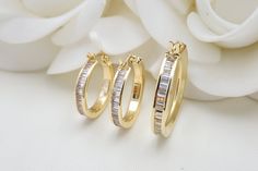 💓 Beautiful 14k yellow gold baguette CZ Hoop Earrings (Channel setting). These hoop earrings are perfect for everyday and every occasion. Elegant, shiny and modern. Will not tarnish or rust. Perfect gift. You will never want to take them off. 💓 Materials: 14k yellow gold Diameter: 17mm - 19mm - 24mm Weights: 2.5 grams - 2.9 gram - 3.3 grams Thickness: 3mm 14k gold stamped Pictures are zoomed to properly capture all the details, the last picture is not zoomed it should give a better size refere Luxury Gold Huggie Earrings Channel Set, Gold Hoop Earrings With Baguette Diamonds For Anniversary, Luxury Gold Hoop Earrings Baguette Cut, Luxury Gold Hoop Earrings With Baguette Diamonds, Luxury Gold Baguette Cut Hoop Earrings, Round Hoop Earrings With Baguette Diamonds For Anniversary, Gold Hoop Earrings With Baguette Diamonds, Baguette Diamond Hoop Earrings For Anniversary, Gold 14k Baguette Diamond Huggie Earrings