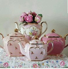 pink and white tea set with flowers in the middle