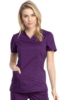 This Modern Classic fit, V-neck top, features front and back yoke seams and front princess seams. Also included are two roomy patch pockets, the right pocket with a convenient pencil stitch, and side vents. Center back length: 26" Details: Collection : WW Revolution Tech Fit : Modern Classic Number of Pockets : 2 Pockets Types of Pockets : Patch Pockets, Pen Slot, No Chest Pocket Features : Knit Details, Side vents, Front princess seams, Front shoulder yoke Manufactured In : Imported Nursing Scrubs Pattern, Types Of Pockets, Scrubs Pattern, Cherokee Woman, Medical Outfit, Lab Coats, Princess Seams, Princess Seam, Scrub Tops