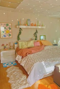 a bed room with a neatly made bed and lots of decorations on the wall above it