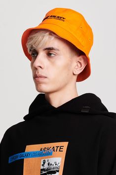 Bucket hat in orange featuring black Chrome Galaxy logo embroidery in the front. Streetwear Bucket Hat With Curved Brim, Solid Color Short Brim Bucket Hat For Streetwear, Solid Curved Brim Bucket Hat For Streetwear, Curved Brim Bucket Hat For Streetwear, Cotton Short Brim Hat With Logo Patch, Cotton Hat With Logo Patch And Short Brim, Casual Bucket Hat With Logo Patch, Casual Bucket Hat With Logo Patch And Short Brim, Casual Bucket Hat With Logo Patch And Curved Brim