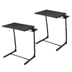 two black tables sitting next to each other on top of a white surface and one is empty