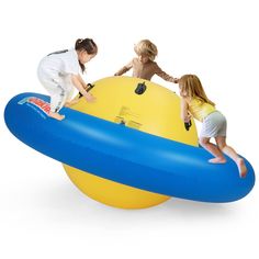 two children are playing on an inflatable object