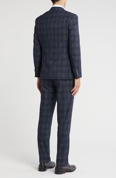 Sophisticated peaked lapels smarten the jacket of this trim-fit suit paired with flat-front trousers and finished in a handsome plaid print. 36" inseam; 10 1/2" rise (size 40R) Jacket has peaked lapels; chest welt pocket; front flap pockets Lined 60% polyester, 39% rayon, 1% spandex Dry clean Imported Single Breasted Business Casual Suiting Sets, Single Breasted Suiting Fabric Sets For Business Casual, Business Casual Single Breasted Suit Sets, Business Casual Single-breasted Suit Set, Fitted Sets With Welt Pockets For Business Casual, Fitted Business Casual Sets With Lapel Collar, Tailored Pantsuit With Lapel Collar For Semi-formal Occasions, Tuxedo Suit With Lapel Collar For Office, Tuxedo Suit With Suit Collar For Work