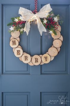 a wreath made out of wood slices with the word merry written on it