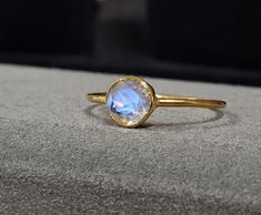 1. 14k Gold Rainbow Moonstone Gold Ring 2. Made to Order 3. Gemstone - Rainbow Moonstone 4. Jewelry Type - Gold Ring 5. Total Weight - 0.970 Gram Approx. 6. Moonstone Weight - 0.60 Carats 7. Gold Weight - 0.850 Grams Approx. 8. Moonstone Size - 6 MM 9. Gold Purity - 14k 10. Band Size - 1 MM 11. Handmade Items 12. AAA Quality Ring 13. Statement Ring 14. 1 Quantity Available 15. Ready to Dispatch in 1 - 2 days.  Pictures are taken under natural and day light. Adjustable 14k Yellow Gold Moonstone Ring, Celestial Moonstone Ring In 14k Gold As Gift, Celestial 14k Gold Moonstone Ring As Gift, Celestial 14k Gold Moonstone Ring For Gift, Handmade Yellow Gold Moonstone Ring In Sterling Silver, Celestial Style 14k Gold Moonstone Ring As Gift, Celestial Style Yellow Gold Moonstone Ring, Gold Round Stackable Gemstones, Yellow Gold Moonstone Jewelry With Birthstone