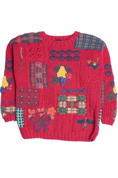 a red sweater with colorful patches on it