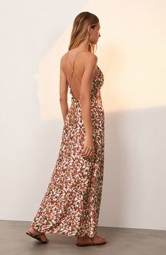 Take a break from the waves in this flowy silk-kissed dress designed with golden straps at the open back and a colorful print. Slips on over head Deep V-neck Sleeveless Lined 80% rayon, 20% silk Dry clean Made in Brazil Hispanic & Latinx Owned/Founded Silk Maxi Dress With Spaghetti Straps For Beach, Backless Silk Midi Dress For Spring, Spring Silk Backless Dress, Summer Party Silk Dress With Floral Print, Silk Beach Dress With Spaghetti Straps, Spring Silk Halter Neck Backless Dress, Summer Silk Halter Neck Backless Dress, Summer Silk Backless Halter Neck Dress, Backless Silk Maxi Dress For Beach