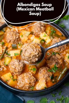 a bowl filled with meatballs and potatoes