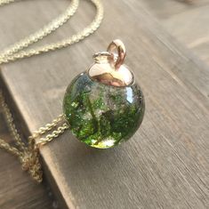 Ships From Pennsylvania! Shorter Shipping Distances Are Kinder To The Planet Materials: Resin, 18 Karat Gold Plated Stainless Steel Necklace, Real Moss Style: Boho & Hippie Pendant Width: 0.5 Inches; Pendant Height: 0.75 Inches; Necklace Length: 18 Inches