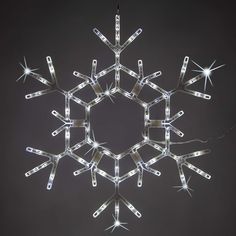 a snowflake with lights hanging from it