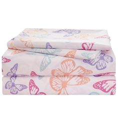 two sheets with butterflies on them and one sheet that has pink, blue, yellow and purple