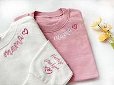 Embroidered Custom Mama Sweatshirt with Kid Name on Sleeve, Personalized Mum Sweatshirt, Mom gifts, Personalized Gifts, New Mom Gift 🌸HOW TO ORDER: Please check our size and color charts to get exactly what you want. Select the correct size and color and fill out the personalization box 🌸ABOUT OUR SWEATSHIRTS/HOODIES: 35% Cotton, 65% Polyester Machine cold wash, inside out, with like colors. Lay flat to dry. Please do not bleach. Please do not iron. Sizes are standard Unisex and run true to size. If women want a loose fit, they should order their usual size. Size down for a fitted look; size up one or two sizes for the oversized/baggy look. Please double-check our size chart to get the right size for you! 🌸Don't forget to check out the rest of our listings for more custom embroidery, an Pink Crew Neck Sweatshirt With Machine Embroidery, Custom Embroidered White Tops For Mother's Day, Long Sleeve T-shirt With Machine Embroidery As Gift, White Sweatshirt With Letter Embroidery As Gift, Embroidered White Tops For Mother's Day, Mother's Day Crew Neck Top With Embroidered Text, Mother's Day Embroidered Text Crew Neck Top, Crew Neck Top With Embroidered Text As Gift, Crew Neck Tops With Machine Embroidery For Gifts