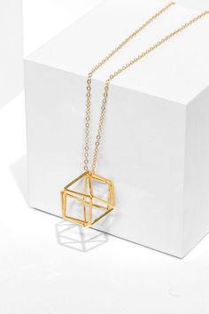 Aviv Jewelry - Raise the fashion bar with this modern 3D polygon pendant. Made of fine gauge gold square wire, this long necklace can stand on its own. Available in yellow and rose gold, in customizable negths. #valentineday #valentinegifts #valentinegiftsideas #giftsforvalentine #todaytab #giftsforher #goldnecklace #goldnecklaces #trendingjewelry #cutenecklace #longnecklace #cutejewelry Minimalist Geometric Gold Jewelry, Minimalist Geometric Gold Necklace, Minimalist Gold Geometric Necklace, Gold Geometric Minimalist Necklace, Modern Gold Geometric Necklace, Minimalist Gold Hexagon Necklace, 3d Polygon, 3d Pendant, Architectural Jewelry