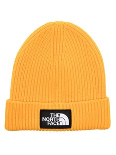 Shop The North Face logo-patch ribbed-knit beanie Streetwear Beanie With Logo Patch, Fall Streetwear Beanie With Ribbed Cuffs, Trendy Yellow Hats For Fall, Trendy Yellow Fall Hat, Trendy Yellow Fall Hats, The North Face Winter Beanie Hat, Casual Solid Color Hats With Logo Patch, Cotton Beanie With Logo Patch, Casual Ribbed Hat For Streetwear