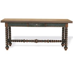 a wooden table with two drawers on one end and an ornate design on the other