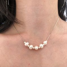 This elegant choker necklace consist of 5 fresh water irregular shape pearl beads and silver beads on solid 925 sterling silver chain. This baroque pearl choker necklace is a perfect gift or bridal jewelry gift set for your love one. Necklace length: 15 in + 1.5 in (adjustable chain)Pearl Size: 7-8mm Jewelry Care: See more information about how to care for your jewelry here. Shipping Policy: Orders will be shipped within 1-3 business days. Economy shipping will take 7-14 days to arrive and stand Elegant Pearl Necklace With Silver Beads As Gift, Classic Pearl Necklace With Silver Beads For Gifts, Classic Pearl Necklace With Silver Beads As Gift, Pearl Necklace With Silver Beads As Gift, Pearl White Single Strand Pearl Necklace In Sterling Silver, Pearl Jewelry With Silver Beads As A Gift, Delicate Pearl White Sterling Silver Necklace, Anniversary Silver Pearl Necklace With Adjustable Chain, Elegant Choker