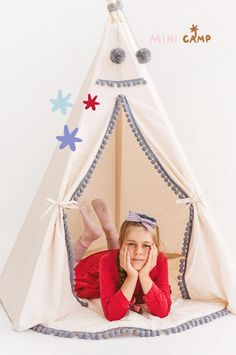 Looking to add a touch of whimsy to your kids' playroom? Check out the MINICAMP Kids Teepee in Off-white with Grey PomPoms. This original design features a rigid frame for stability, ensuring endless playtime adventures. The soothing off-white color and playful grey pom-poms make it a charming addition to any playroom, reading nook, or bedroom. Made from unbleached teepee canvas and supported by smooth round wooden poles, it's both durable and stylish. Eco-friendly packaging included. Childrens Teepee, Kids Teepee, Chic Kids, Modern Kids Room, Children Play, Grey Trim