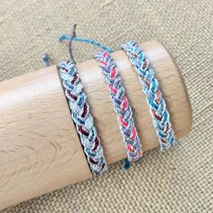 This listing is for one metallic cord braided bracelet.  Choose from one of 3 color ways- 1.  Navy/maroon/white with silver metallic cord 2.  Gray/pink/purple with silver metallic cord 3.  Teal/copper/blue with silver metallic cord Have an idea for a custom listing?  Send me a convo, I reply quickly.   Perfect for stocking stuffers!   Each bracelet will fit all wrist sizes and is 100% waterproof.   All bracelets are made and ready to ship within 48 hours.  Thanks for looking! Friendship Adjustable Braided Waxed Cord Bracelets, Adjustable Braided Waxed Cord Bracelets, Friendship Braided Bracelets With Adjustable Waxed Cord, Friendship Braided Bracelet In Nylon Cord, Friendship Braided Bracelet With Adjustable Nylon Cord, Adjustable Waxed Cord Braided Bracelet, Festival Braided Bracelets With Sliding Knot, Silver Braided Bracelet With Sliding Knot, Adjustable Multicolor Waxed Cord Bracelets