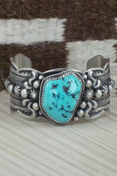 This Sleeping Beauty turquoise and sterling silver bracelet was made by Navajo silversmith Roland Dixson. The inside is signed and stamped sterling.Size: 5 3/4" (will fit up to a 7 1/4" wrist)Gap: 1 1/2"Width: 1 1/2"Free shipping on all orders! We ship with USPS and always include tracking. All orders ship within a day of payment.Returns are accepted up to 30 days after you receive your order. Just send us a message. Our shop offers cash back or store credit. The item must be returned in new con Western Style Blue Sterling Silver Bracelet Gift, Southwestern Style Stamped Turquoise Bracelets, Southwestern Style Turquoise Stamped Bracelets, Artisan Sterling Silver Turquoise Bracelet Collectible, Handmade Turquoise Sterling Silver Western Bracelet, Southwestern Stamped Turquoise Sterling Silver Bracelet, Western Style Blue Sterling Silver Collectible Bracelet, Western Style Blue Sterling Silver Bracelet Collectible, Southwestern Style Sterling Silver Turquoise Bracelet