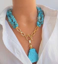 📍 Description :  The handmade multistrand necklace has been designed with genuine raw Turquoise gemstone in asymmetric shape and sizes. 💎Pendant :  Genuine Raw Turquoise gemstones  💥 The colours of the stone may differ slightly in photo shoots caused by lighting and reflections. ✂ Materials : The natural stone used are; Blue Turquoise gemstone in different shapes and sizes. The chain and gold-colored materials used are 14 carat gold plated on brass and do not tarnish. 📐 Dimensions : It has a Turquoise Multistrand Necklace, Elegant Multi-strand Turquoise Necklace Gift, Unique Multi-strand Turquoise Necklace Gift, Handmade Double Strand Turquoise Necklace For Gift, Gift Lariat Turquoise Necklace With Natural Stones, Raw Turquoise, Necklace Chunky, Trendy Necklaces, Gift For Wife