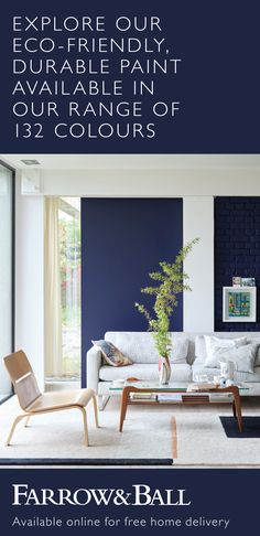 a living room with blue walls and furniture in the background, is featured by farrow & ball