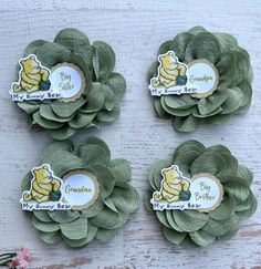 three green flowers with winnie the pooh stickers on them