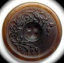 a button with an ornate design on it