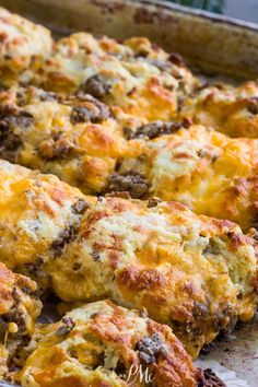 cheesy meat and cheese muffins in a baking pan ready to be eaten