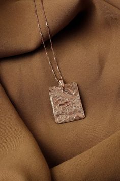 Large rose gold pendant necklace, Big square pendant large Square medallion necklace, Rectangular necklace Chunky pendant, Charm necklace  Charm necklace with a textured rectangle pendant. The pendant has a sculptural look - the making process results every time with a different pattern so every pendant is unique.  Size XL For other sizes/models/complete sets explore further in the section "Minimal necklaces" in our shop: https://www.etsy.com/shop/MairBerlin?ref=seller-platform-mcnav&section_id= Cheap Rectangular Pendant Necklaces For Women, Luxury Handmade Necklace With Square Pendant, Cheap Metal Necklace With Rectangular Pendant, Affordable Gold Rectangular Pendant Jewelry, Luxury Necklace With Large Square Pendant, Luxury Drop Necklace With Large Pendant, Cheap Handmade Jewelry With Rectangular Pendant, Luxury Necklace With Large Pendant For Gift, Cheap Women's Necklaces With Rectangular Pendant