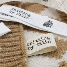 there is a label that says knitting by ellen on the side of a cow print sweater