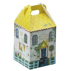 a paper box with a house design on the front and sides, decorated with flowers