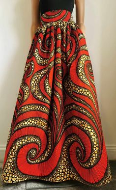 Handmade Unlined African Print Maxi / Full-Length Skirt     Elastic waistband skirt at the back     2 open side-entry pockets     Length: 46"     100% Wax Cotton     Handmade     Made in the UK (Colours may vary due to lighting on images. The product images are closest to the true colour of the product.) Red Full Skirt With Elastic Waistband, Long Red Skirt With Pockets, Orange Skirt Bottoms With Pockets, Flowy Orange Maxi Skirt With Elastic Waistband, Orange Full Lined Maxi Skirt, Orange Full Maxi Skirt With Lined Skirt, Orange Full Maxi Skirt With Lining, Orange Flared Maxi Skirt Lined, Long Skirt With Wide Waistband